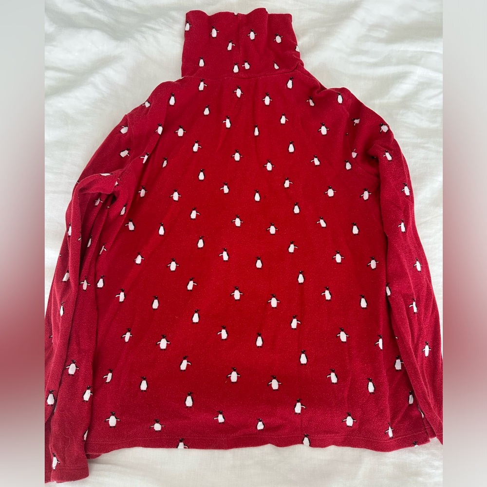 women’s red turtleneck with penguins